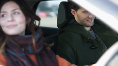 Couple driving car