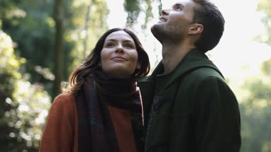 Couple in forest in Fall