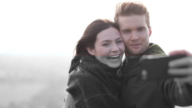 Couple posing for selfie in the countryside