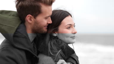 Couple on beach in Winter