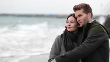 Couple on beach in Winter