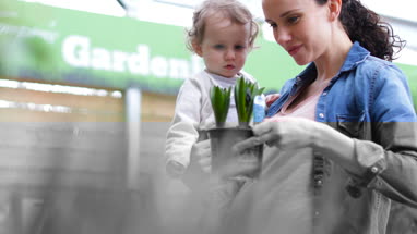 Mother with daughter at garden centre