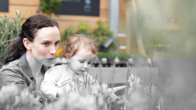 Mother with daughter at garden centre