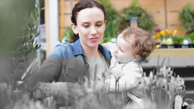Mother with daughter at garden centre