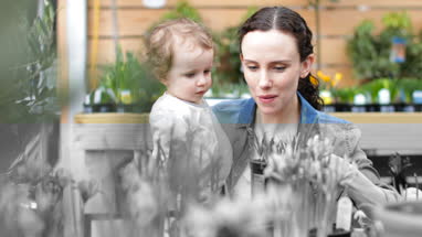 Mother with daughter at garden centre