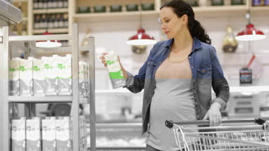 Pregnant woman grocery shopping