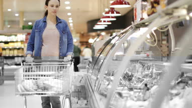 Pregnant woman grocery shopping
