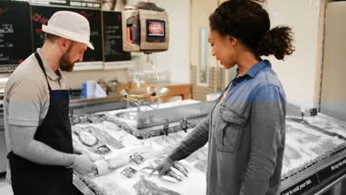 Customer asking fishmonger for advice