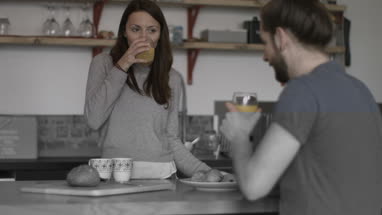 Young couple enjoying breakfast together