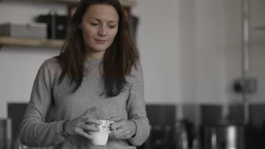 Young adult female having breakfast 