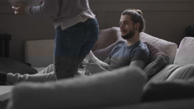Puppy looking at bowl of popcorn