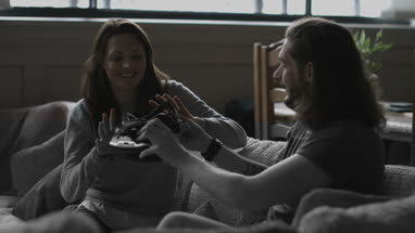 Young adult female using VR headset for the first time