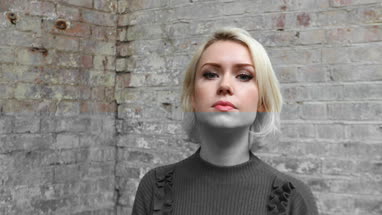 Confident young adult female looking confidently at camera