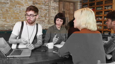 Group of young entrepreneurs working on a presentation