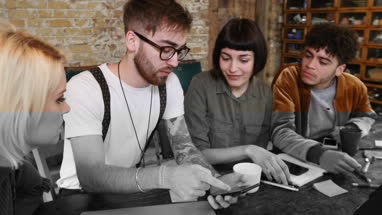 Group of young entrepreneurs working on an app