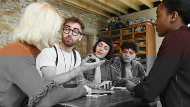 Group of young entrepreneurs working on an app