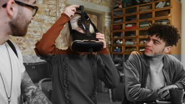 Group of young entrepreneurs in a meeting with VR headset