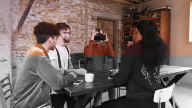 Group of young entrepreneurs in a meeting with VR headset