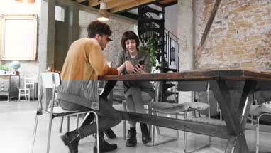 Young entrepreneurs in a meeting discussing app 