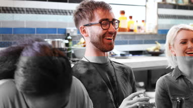 Group of friends playing cards together