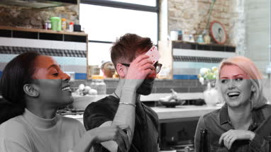 Group of friends playing cards together 