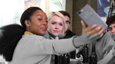 Group of friends posing for a group selfie