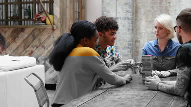 Group of friends playing retro game in pub