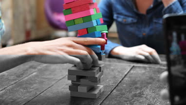 Close-up of hand playing tumbling towers