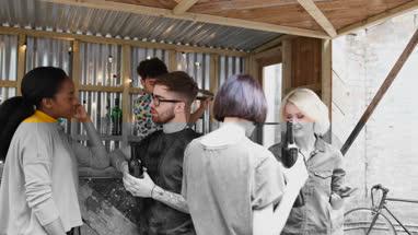 Two friends at a street food bar taking selfie