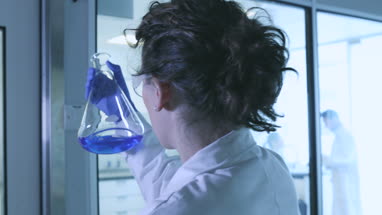 Two female scientists discussing results of experiment