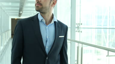 Businessman walking through airport terminal