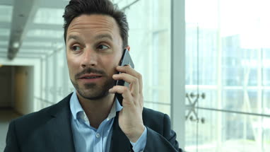 Businessman on phonecall whilst travelling