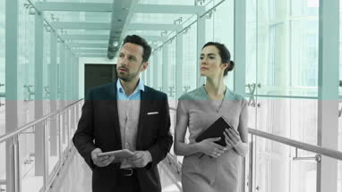 Businessman showing new employee the office