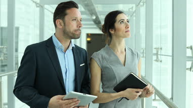 Relator showing new office space to businesswoman