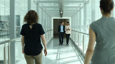 Business colleagues greeting each other on way to office