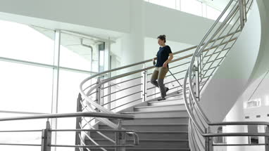 Businesswoman using smartphone app on her way to work