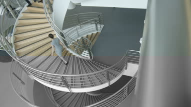 Overhead shot of business executives passing on staircase