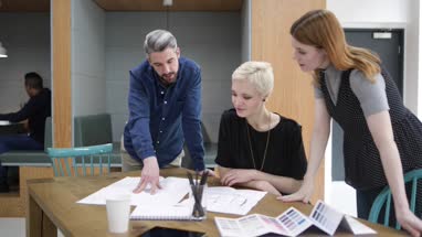 Group of coworkers discussing a design project