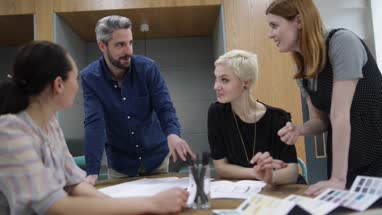 Group of coworkers discussing a project