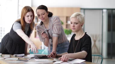 Female designers agreeing on samples in a meeting