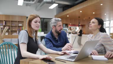 Coworkers discussing a presentation