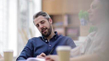 Businessman thinking in a meeting