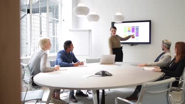Female business executive giving a presentation
