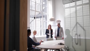 Business executives leading a brainstorm meeting
