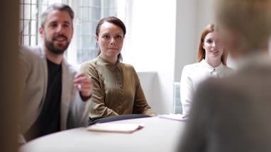Colleagues listening in a business meeting