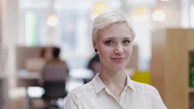 Portrait of female entrepreneur in a modern shared workplace