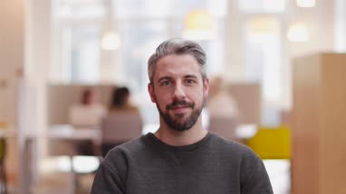 Portrait of male entrepreneur in a modern shared workplace