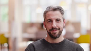 Portrait of male entrepreneur in a modern shared workplace