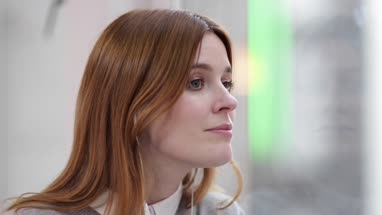 Female listening to audio with headphones