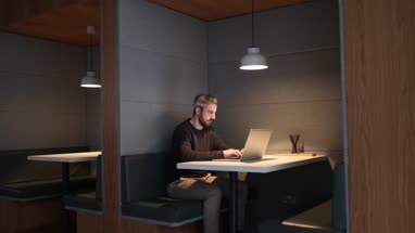 Businessman working late at night in office alone
